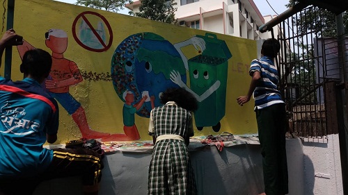 Students doing wall painting